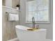 Modern bathroom featuring a standalone tub, walk-in shower, and neutral tile creating a spa-like retreat at 1491 Greenshade Way, Mount Pleasant, SC 29464