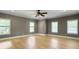 Large bedroom with wood floors and lots of natural light from the many windows at 1491 Greenshade Way, Mount Pleasant, SC 29464