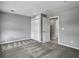 Well-lit bedroom with plush carpeting, a closet, and a doorway creating a cozy and inviting space at 1491 Greenshade Way, Mount Pleasant, SC 29464