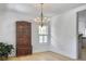 Dining room with hardwood floors, chandelier, and antique hutch at 1491 Greenshade Way, Mount Pleasant, SC 29464