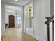 Entryway view to the dining room and a custom mud room bench at 1491 Greenshade Way, Mount Pleasant, SC 29464