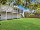 A beautifully landscaped backyard with a screened porch and mature trees at 1491 Greenshade Way, Mount Pleasant, SC 29464