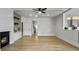 Open-concept living room with hardwood flooring, a fireplace, and neutral paint colors throughout at 1491 Greenshade Way, Mount Pleasant, SC 29464