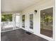 Cozy covered porch with stylish lighting fixtures and scenic views at 1491 Greenshade Way, Mount Pleasant, SC 29464