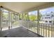 Inviting screened-in porch offering outdoor seating and picturesque neighborhood views at 1491 Greenshade Way, Mount Pleasant, SC 29464