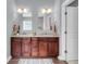 Lovely bathroom features a double vanity with granite countertops and a decorative rug at 1523 Nautical Chart Dr, Charleston, SC 29414