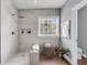 Beautifully renovated bathroom features large shower with a built-in shower seat and modern shower head at 1523 Nautical Chart Dr, Charleston, SC 29414