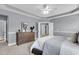 Spacious main bedroom features elegant tray ceiling, modern fan, and decorative furniture at 1523 Nautical Chart Dr, Charleston, SC 29414