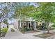 Lovely two-story home with a driveway leading to a detached garage and a well-manicured front lawn at 1523 Nautical Chart Dr, Charleston, SC 29414