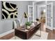 Home office space with a modern desk, artwork, and French doors at 1523 Nautical Chart Dr, Charleston, SC 29414