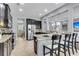 Well-equipped kitchen with dark wood cabinets, stainless steel appliances, granite countertops, and a breakfast bar at 1523 Nautical Chart Dr, Charleston, SC 29414