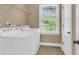 Well-lit laundry room with modern appliances and storage shelving at 1523 Nautical Chart Dr, Charleston, SC 29414