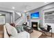 Cozy living room featuring a fireplace, neutral walls, and comfortable seating arrangement and hardwood floors at 1523 Nautical Chart Dr, Charleston, SC 29414