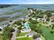 Picturesque aerial view showcasing a beautiful coastal home nestled amongst lush greenery and waterways at 1625 Teal Marsh Rd, Charleston, SC 29412