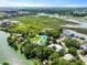 Stunning aerial view of a charming coastal property surrounded by lush greenery, waterways, and serene landscapes at 1625 Teal Marsh Rd, Charleston, SC 29412