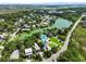 Aerial view of a charming neighborhood with lush greenery and a serene lake at 1625 Teal Marsh Rd, Charleston, SC 29412