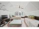 Spacious bedroom featuring two beds, a ceiling fan, and arched window with ample natural light at 1625 Teal Marsh Rd, Charleston, SC 29412