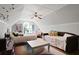 Spacious bedroom featuring two beds, a ceiling fan, and arched window with ample natural light at 1625 Teal Marsh Rd, Charleston, SC 29412