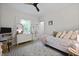 Bright bedroom with a ceiling fan, a comfortable bed, and a large window at 1625 Teal Marsh Rd, Charleston, SC 29412