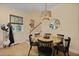 Cozy dining area with a round table, natural light, and staircase access at 1625 Teal Marsh Rd, Charleston, SC 29412