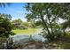 Waterfront views from a lush backyard with a small pier, offering a serene setting and access to the water at 1625 Teal Marsh Rd, Charleston, SC 29412
