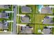 Aerial view of neighborhood featuring green lawns, pools, and driveways, reflecting modern suburban living at 2064 Parish House Cir, Johns Island, SC 29455