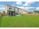 Expansive backyard featuring a well-maintained lawn, screened in porch, and privacy fence, perfect for outdoor activities at 2064 Parish House Cir, Johns Island, SC 29455