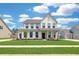 Charming two-story home featuring a well-manicured lawn, inviting front porch, and classic architectural details at 2064 Parish House Cir, Johns Island, SC 29455