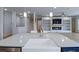 Modern kitchen features a large island, farmhouse sink, and seamlessly connects to the living area at 2064 Parish House Cir, Johns Island, SC 29455