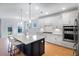 Bright kitchen with island featuring quartz countertops, stainless appliances, and bar seating at 2064 Parish House Cir, Johns Island, SC 29455
