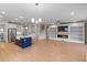 Open floor plan showcases a modern kitchen, living room with fireplace, and staircase to the upper level at 2064 Parish House Cir, Johns Island, SC 29455