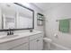 Stylish bathroom features a double vanity, black fixtures, shiplap, and framed mirror at 209 Parkwood Vista Way, Summerville, SC 29486