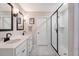 Bathroom with double sinks, modern fixtures, and a frameless glass shower enclosure at 209 Parkwood Vista Way, Summerville, SC 29486