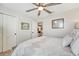 Comfortable bedroom with a ceiling fan, neutral decor, and access to other rooms at 209 Parkwood Vista Way, Summerville, SC 29486