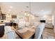 Open-concept dining area with views of the kitchen and living room, ideal for entertaining guests at 209 Parkwood Vista Way, Summerville, SC 29486