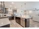 Modern kitchen featuring stainless steel appliances, a central island, and stylish pendant lighting at 209 Parkwood Vista Way, Summerville, SC 29486