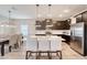 Modern kitchen featuring an island with seating, stainless steel appliances, and dark wood cabinets at 209 Parkwood Vista Way, Summerville, SC 29486