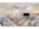 Spacious living room with a ceiling fan, comfortable seating, and wood-look flooring at 209 Parkwood Vista Way, Summerville, SC 29486