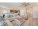 Open-concept living room with a view of the kitchen and dining area, perfect for entertaining at 209 Parkwood Vista Way, Summerville, SC 29486