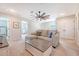 Cozy living area with a comfortable sectional sofa, ceiling fan, and neutral color scheme at 209 Parkwood Vista Way, Summerville, SC 29486