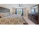 Main bedroom suite with a king bed, sitting area, and large window for natural light at 209 Parkwood Vista Way, Summerville, SC 29486