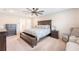 Main bedroom featuring a large bed, ceiling fan, and neutral color scheme at 209 Parkwood Vista Way, Summerville, SC 29486