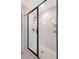 Bathroom shower features white subway tile, black trim and fixtures, and glass enclosure at 209 Parkwood Vista Way, Summerville, SC 29486