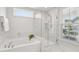 Bright bathroom features a soaking tub and separate glass-enclosed shower at 2267 Kemmerlin St, Johns Island, SC 29455