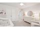 Well-lit Bedroom boasts a white crib, dresser, and cozy armchair, creating a serene and inviting space for a baby at 2267 Kemmerlin St, Johns Island, SC 29455