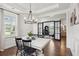 Open dining room with hardwood floors, modern lighting, and views into other rooms at 2267 Kemmerlin St, Johns Island, SC 29455