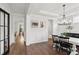 Elegant dining room with hardwood floors, white wainscoting, and modern chandelier at 2267 Kemmerlin St, Johns Island, SC 29455