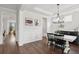 Stylish dining room with hardwood floors, white wainscoting, and modern chandelier at 2267 Kemmerlin St, Johns Island, SC 29455