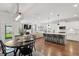 Open floor plan with a kitchen and dining area, featuring a table with seating for four at 2267 Kemmerlin St, Johns Island, SC 29455