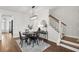 Modern dining area with a round table, stairway, and contemporary decor at 2267 Kemmerlin St, Johns Island, SC 29455